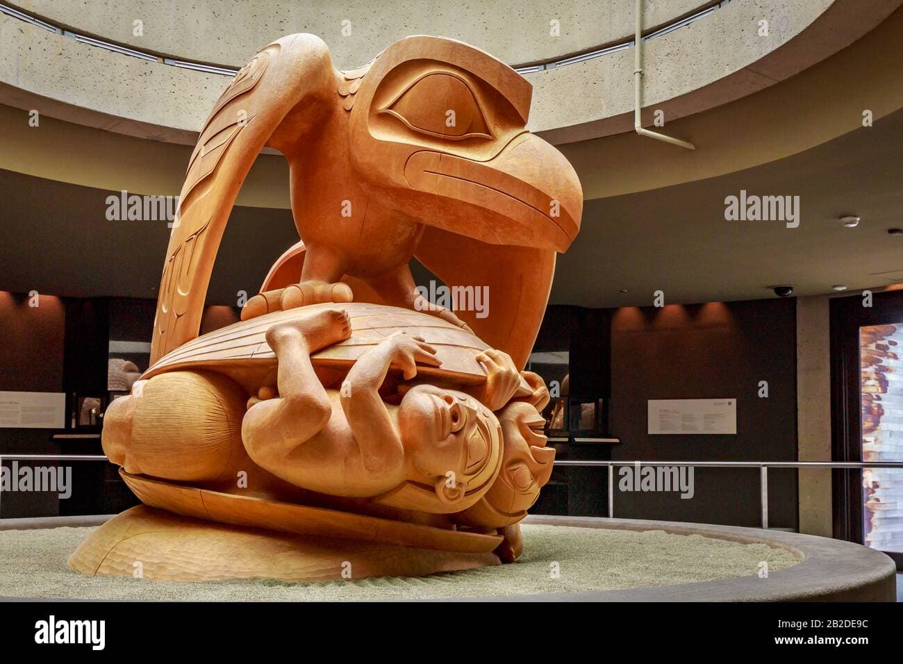 The yellow cedar sculpture The Raven and the First Men by Bill Reid, in ...