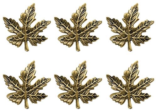 a green napkin with a gold leaf on it